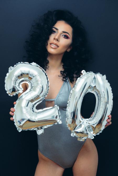 Woman Wearing Grey Swimsuit Holding Grey Balloons