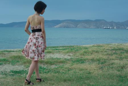 Woman Wearing Pink and White Floral Halter-top Mini Dress