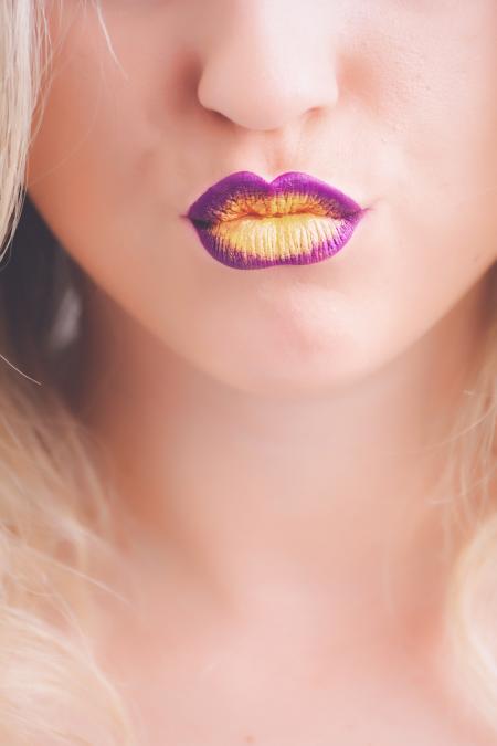 Woman Wearing Purple and Yellow Lipstick
