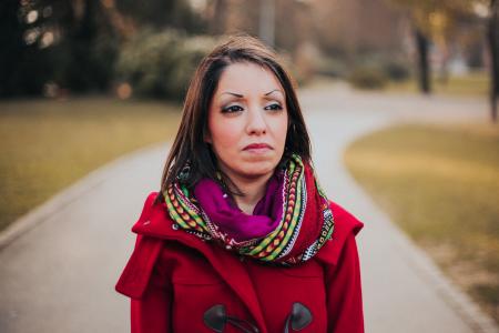 Woman Wearing Red Coat And Scarf