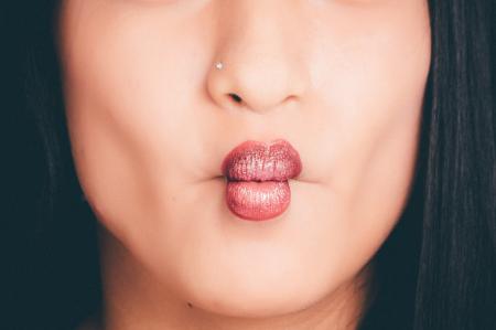 Woman Wearing Red Lipgloss