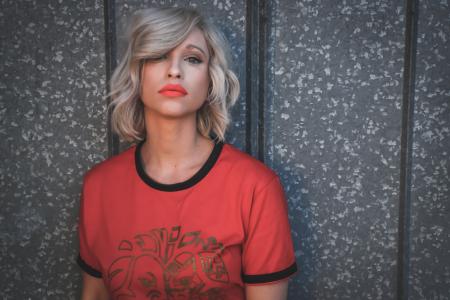 Woman Wearing Red Shirt on Gray Background