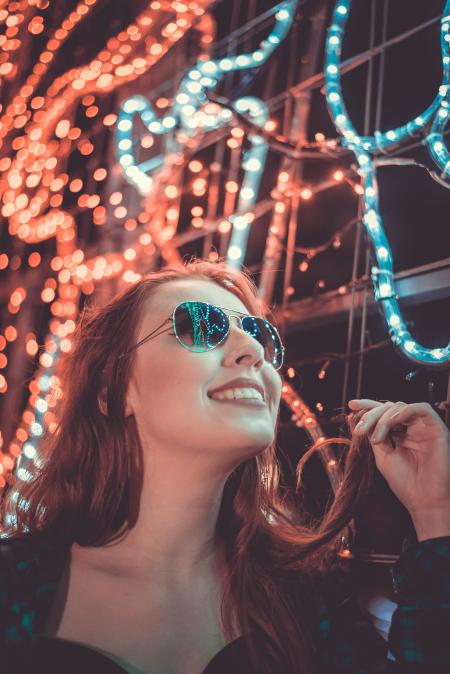 Woman Wearing Sunglasses Holding Her Hair