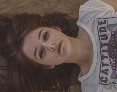Woman Wearing White and Black Cattitude-printed Shirt