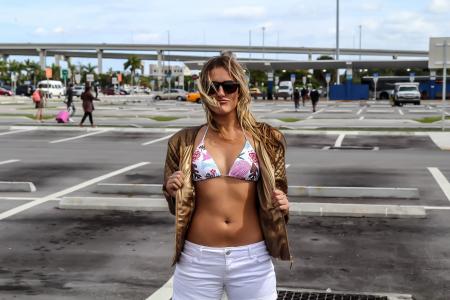 Woman Wearing White and Pink Floral Bikini Top and White Shorts