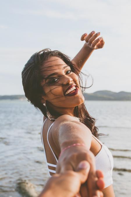 Woman Wearing White Bralet Near Seashore during Daytime