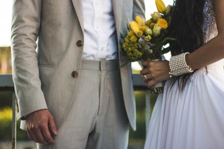 Woman Wearing White Dress And Holding Bouquet