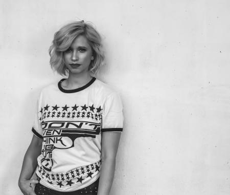 Woman Wearing White Labeled Shirt in Grayscale Photography