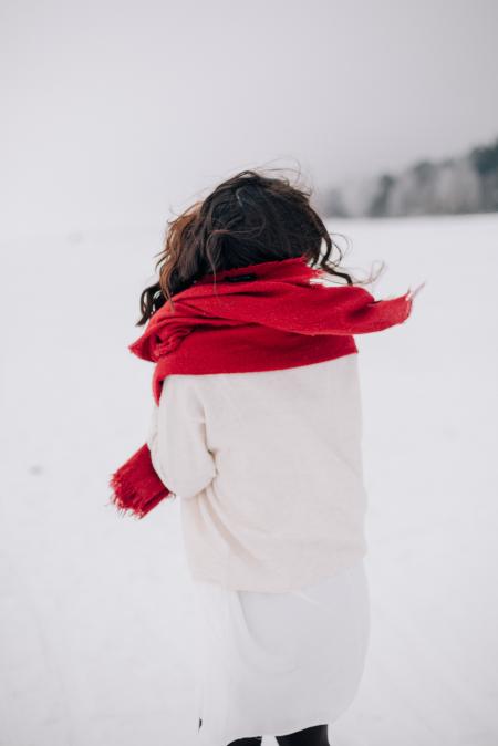 Woman Wearing White Long-sleeved Shirt Standing on Snow