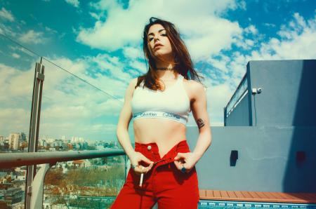 Woman Wearing White Sports Bra And Red Bottoms