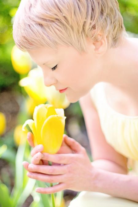 Woman Wearing Yellow Dress Holding Yellow Tulip Flower