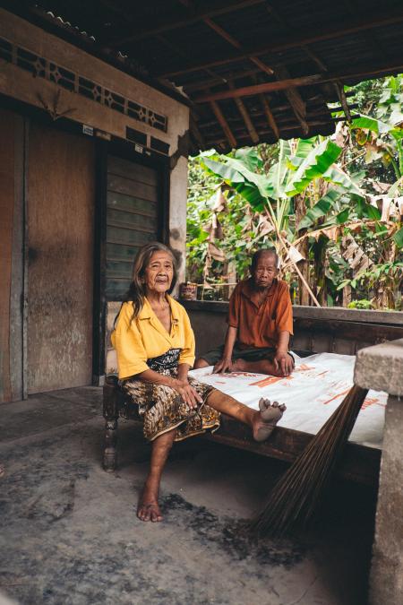 Woman Wearing Yellow V-neck Shirt Sitting Beside Man