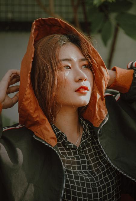 Woman Wears Black and Orange Zip-up Jacket