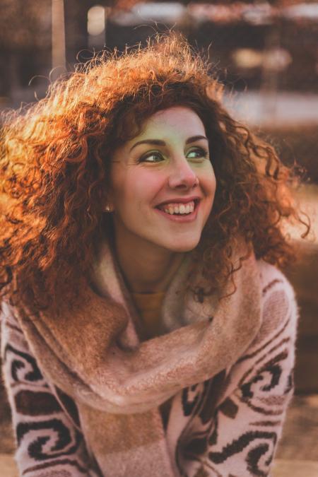 Woman With Blonde Hair Wearing Brown Sweater