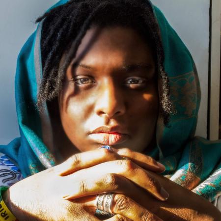 Woman With Dreaded Hair Wearing Green Hijab