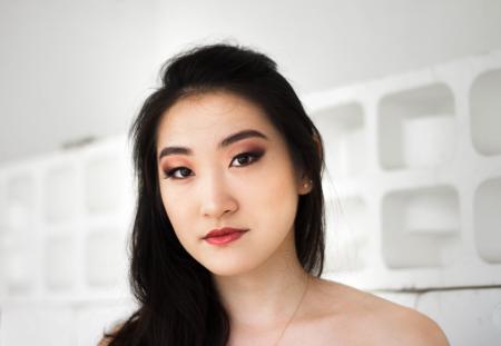 Woman With Necklace Near Wall