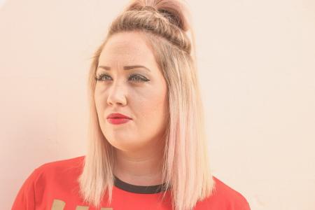 Woman With Tied Hair Wearing Red Top