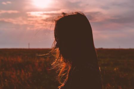 Woman's Silhouette Photo during Sunset