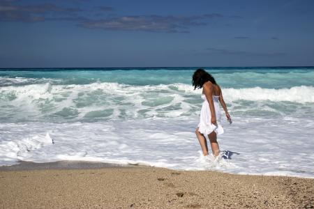 Women Wearing White Dress on the Sea during Daytime