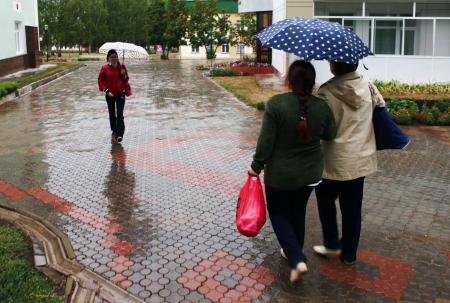 women with umbrellas