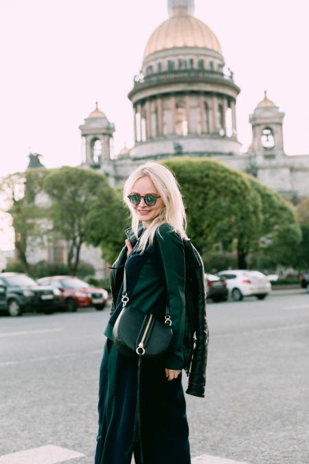 Women's Black Jacket and Black Skirt Near Building