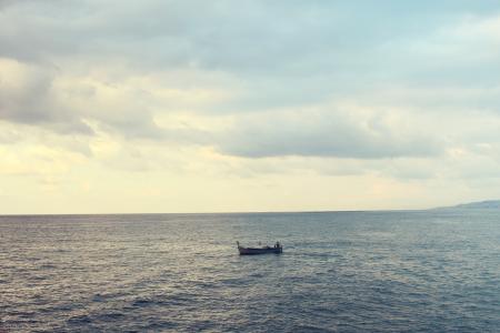 Wooden Boat on Water on Calm Body of Water during Cloudy Daytime Sky