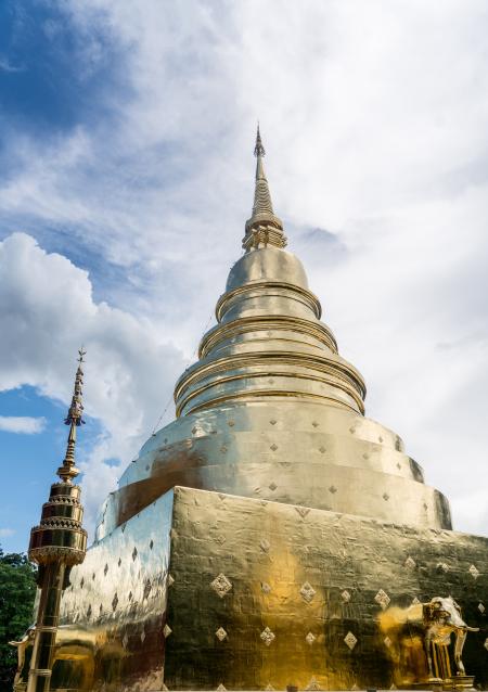 Worm's Eye View of Gold Tower Under Cloudy Sky during Daytime