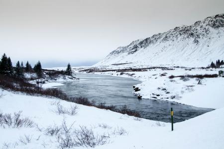 Yellow and Black Pole Near River