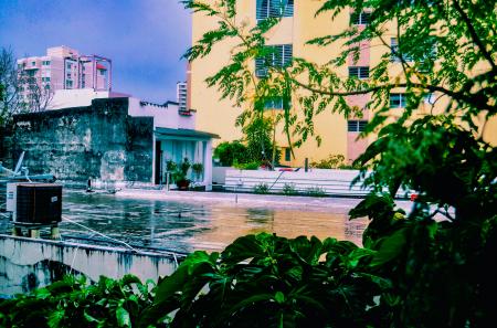 Yellow Concrete Building Near Body of Water