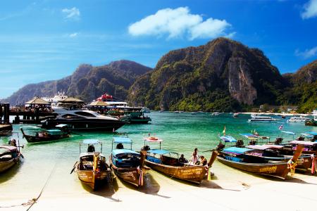 Yellow Wooden Boat Dock on White Sand Beach