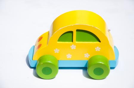 Yellow wooden toy car