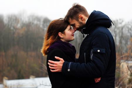 Young Couple on Woman during Winter