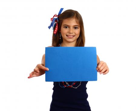 Young girl holding a blank blue sign