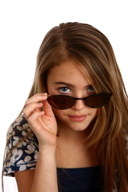 Young girl posing with sunglasses