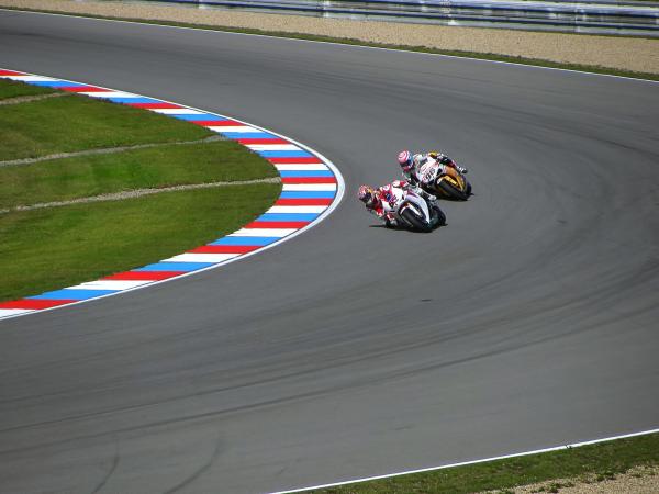 2 Motorcycle Racing on Asphalt Road during Daytime
