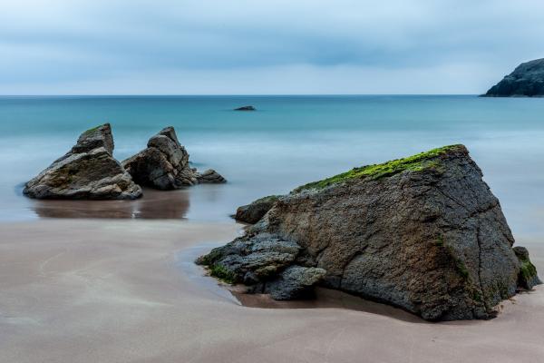 3 Brown Boulders on Seashore during Daytime
