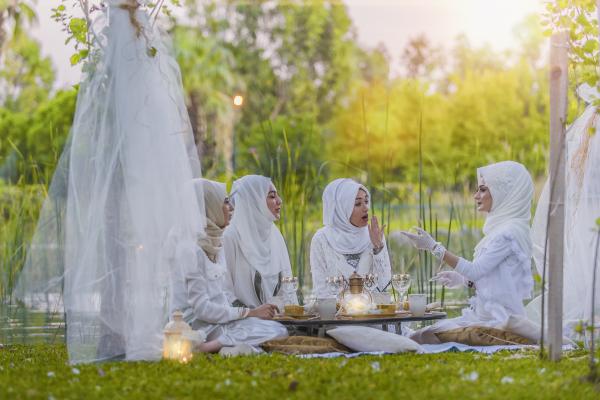 4 Women in White Abaya Wedding Gown Having Picnic Near Trees