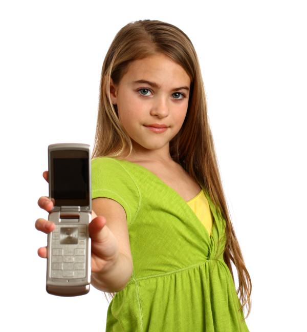 A beautiful young girl holding a cell