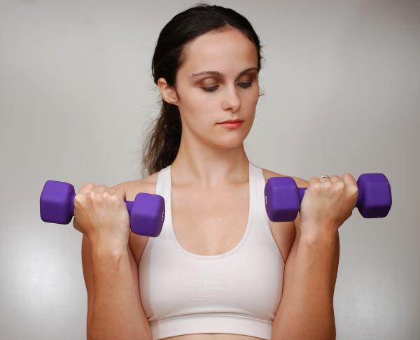 A beautiful young woman exercising