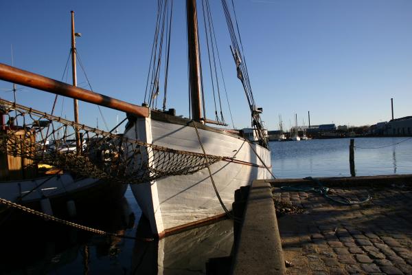 A boat by the harbor