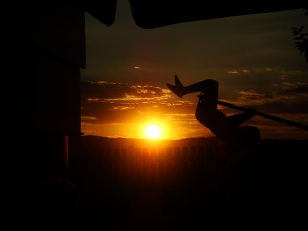 A child playing at sunset