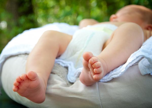 A close-up of tiny baby feet
