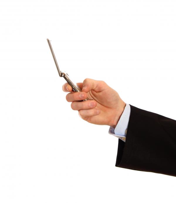 A hand holding a cell phone