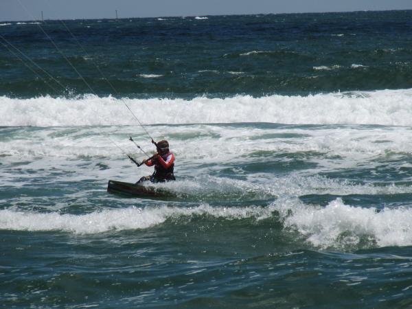 A kitesurfer at sea