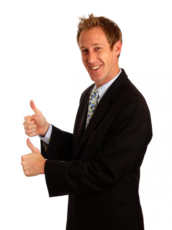 A young businessman giving a thumbs up