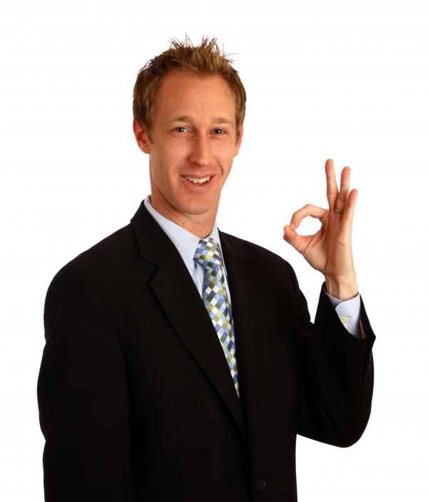 A young businessman giving an ok signal