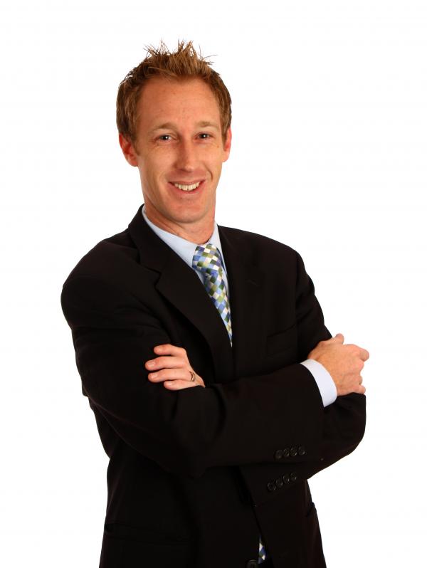 A young businessman with crossed arms
