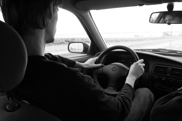 A young man behind the wheel