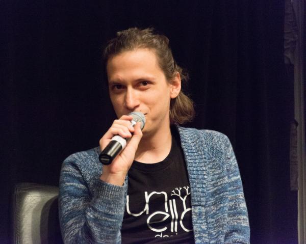 Aaron Lemke (Unello Design) discussing at indie dev panel at SVVR (microphone at mouth looking slightly left)