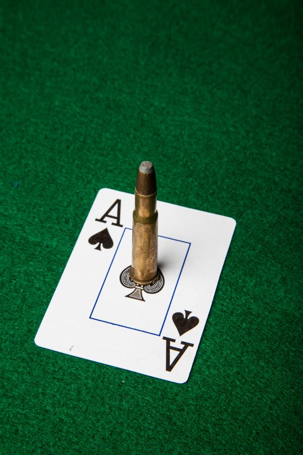 Ace of spade with bullet